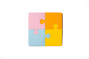 Four Blank Multi-Colored Jigsaw Puzzle Pieces