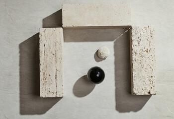 Flatlay minimal natural stone, marble or travertino surface background with block travertino stones. Template for showcase, presentations, branding, web desing, posts.