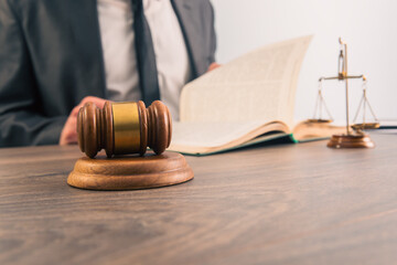 Male lawyer or judge working with Law books