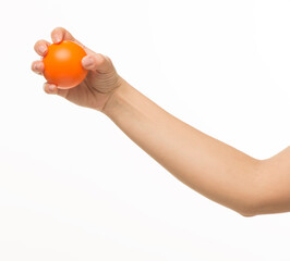 hand holding orange sponge ball isolated