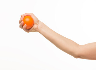 hand holding orange sponge ball isolated
