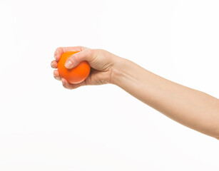 hand holding orange sponge ball isolated