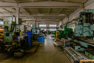 Industrial machine tools inside metalworking workshop