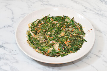 Korean Leek pancake on bright background.