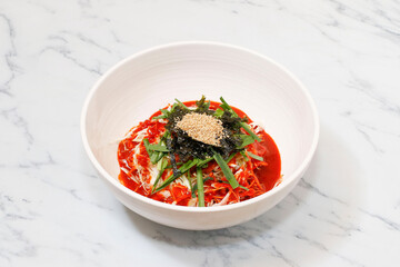 Korean Spicy Noodles on bright background.