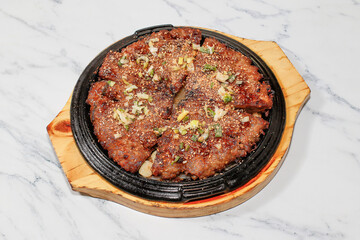 Korean Grilled Short Rib Patties on bright background.