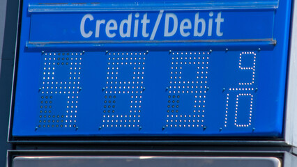 high gas prices $4.89 $4.99 $5 5 dollars close-up