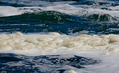 Selective focus picture with noise effect of river foam at Rhine Falls river. Foam can be formed...