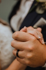 Obraz premium bride and groom hold hands while dancing