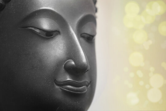  The head of an ancient Buddha statue was made of bronze. image on copy space white background.