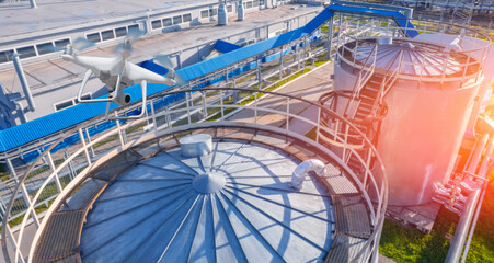 Industrial application drone with camera. Industry control and inspection oil refinery plant site