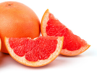 whole and cut fresh grapefruit and slices isolated on white background, Blood oranges whole and sliced on white surface (seen from above). Ripe half of pink grapefruit citrus fruit and green leaves.