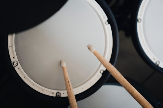 electronic drumsticks and drums on a dark background. Playing training drums.