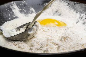 step by step batter mix for pancakes flour milk and egg