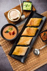 Cut Masala dosa or spring dosa is a South Indian meal served with sambhar and coconut chutney.