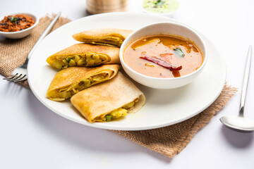 Cut Masala dosa or spring dosa is a South Indian meal served with sambhar and coconut chutney.