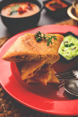 Cut Masala dosa or spring dosa is a South Indian meal served with sambhar and coconut chutney.