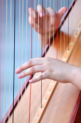 a chinese girl playing the harp	