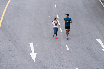Asian couple, they are jogging and exercising.