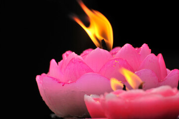 Flame of red candles in temple 