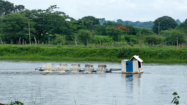 Aerator in a pond in a shrimp farm, in the La Segua Wetlands outside of Chone, Ecuador