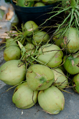 Fresh coconut, a popular green fruit among Thais and foreigners. It has a sweet taste and a refreshing feeling.