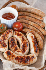 Grilled sausages with sauce and vegetables. Summer rest concept