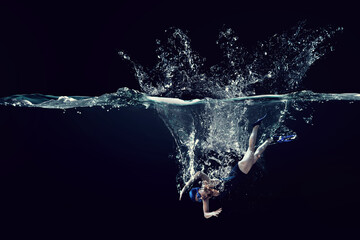 Obraz na płótnie Canvas Professional woman swimmer on a wave