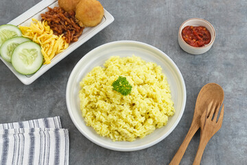 Nasi kuning, Indonesian traditional food, made from rice cooked with turmeric and coconut milk and spices.
