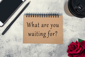 Motivational and inspirational quote on brown note book