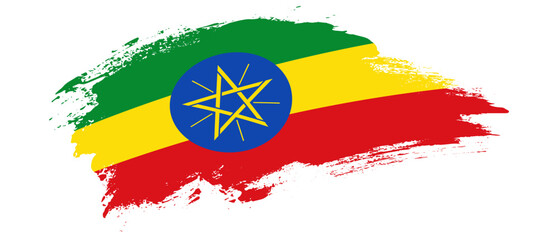 National flag of Ethiopia with curve stain brush stroke effect on white background - obrazy, fototapety, plakaty