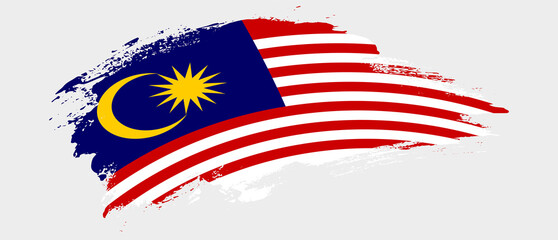 National flag of Malaysia with curve stain brush stroke effect on white background