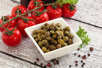 Marinated green capers in the bowl