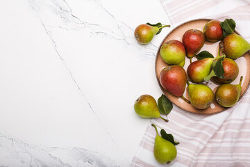 Fresh pears on light  marble background, flat lay composition. space for text