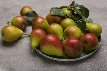 Ripe juicy pears on light cement  table, top view