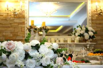 Table setting in a restaurant. Table setting with glasses, cutlery and plates. Restaurant interior.