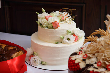 Obraz na płótnie Canvas Wedding cake. Birthday cake with decorations. Culinary arts desserts. Wedding cake with decoration. The art of cooking in sweet dishes.