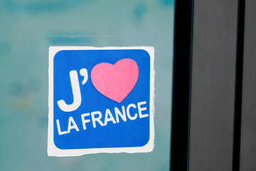 j'aime la France text in french sticker on windows means I love France with red heart icon