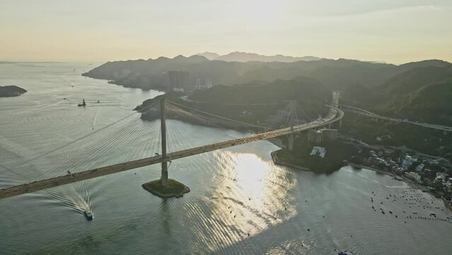 Aerial view of sunset of Tsing Yi with amazing Ting Kau Bridge in Hong Kong