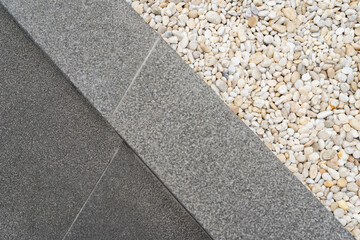 White pebble stone texture on the ground. The pebbles closely stone texture features