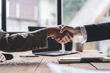 business partner handshake concept Colleagues shaking hands Successful deal after a great meeting. Blurred background.