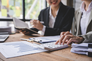 Young colleagues having great business conversations in a modern coworking office. Teamwork concept. Horizontal blurry background. Fireworks.