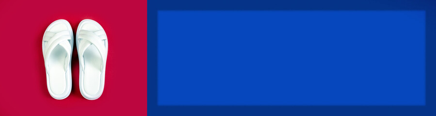 Women's summer white slippers on a red background. Slippers. Banner for insertion into site. Place for text cope space. Horizontal image