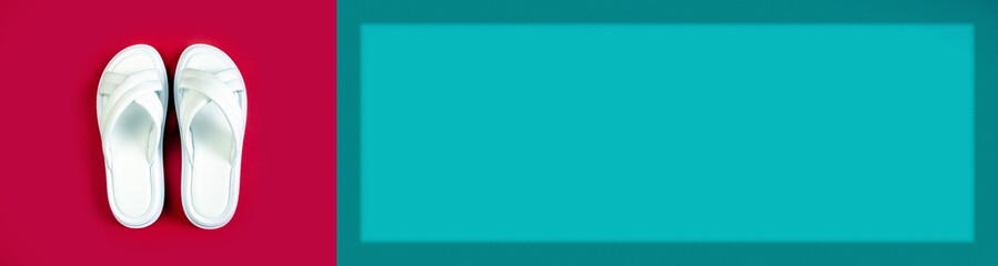 Women's summer white slippers on a red background. Slippers. Banner for insertion into site. Place for text cope space. Horizontal image