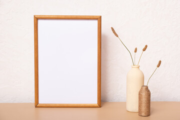 Mock up empty wooden frame mockup, dried grass in vase on white background, interior, home design. Art concept. copy space