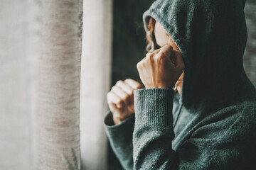 Woman having a bad day with desperation and frustration. Side view of lonely female at home with...