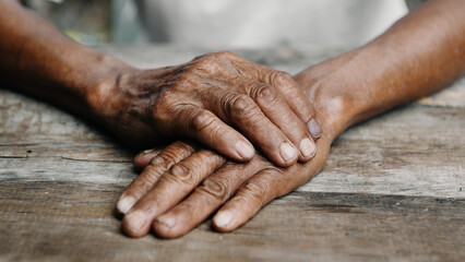  male wrinkled hands, old man is wearing.
