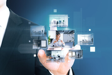 Close up of businessman hand pointing at creative digital picture gallery on blue background. Photo...