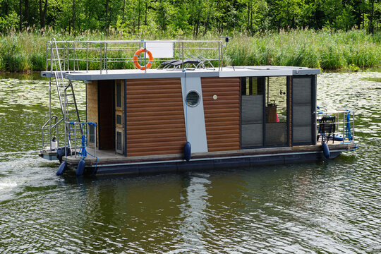 Modern House Boat Swimming On Lake