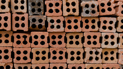 The brick pattern background has a variety of orange colors.